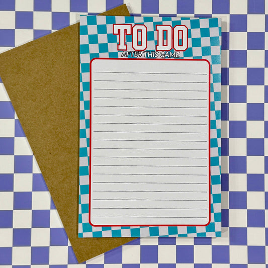 Notebook with 'To Do' list on a checkered background